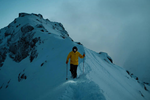 Person using Hardworking Tactical LED Headlamp With Five LEDs 650 Lumen Spot And Flood Beam Plus Hardhat Mount in snow-covered mountains