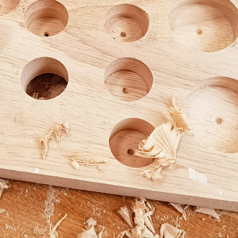Top Tier 21 Piece Forstner Bit Set Made For No Sweat Drilling On Any Project With Carbide Tipped Wood Drill Bits Covering Metric Sizes 10 To 42 Mm Round Shank And Quick Snap Depth Rings showing clean counterbore cuts in wood.