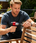 Man using Rivet Nut Tool Kit M3 M8 Plug And Play Quick Change System for Blind Insert Nuts on wooden chair, outdoor setting
