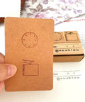Top Shelf Wooden Stamp Set Featuring Date Time Notes Stamps For Crafting Journaling Planner Organization Durable Natural Wood And Rubber Design Super Slick Ink Application Killer Combo showing analog clock face stamp on kraft card.