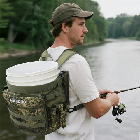 Man fishing with Five Gallon Bucket Backpack With Rod And Pliers Holder And Multiple Pockets For Fishing, Hunting, And Apple Picking In Camouflage, Hands Free Tackle Pack For Easy Outdoor Carry on his back by a river.