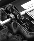 Close-up of 48DP Metal Pinion Gear Set for 1/18 RC Cars with 2.3mm Shaft, installed in transmission showcasing 14T gear.