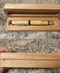 Wooden pen box with concealed brass barrel hinges, showcasing the sleek storage for a handcrafted pen