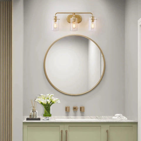 Gold Vanity Light With Seeded Glass Three Light Bathroom Fixture Modern Design hardwired above a round mirror