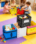 Six Pack Collapsible Fabric Storage Bins With Sturdy Handles For Classroom And Playroom on colorful floor, holding toys and books.