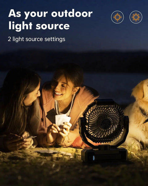 Two people playing cards at night with 3 In 1 Camping Fan With 36000mAh Battery, Detachable Power Bank, LED Light And Hook nearby