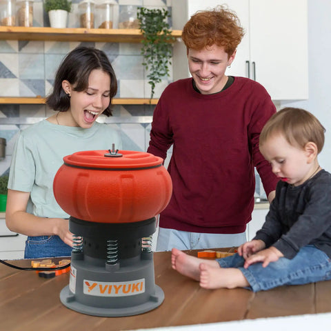 Electric Five Pound Vibratory Tumbler For Deburring And Polishing Metal Parts With Walnut Shell Media on kitchen counter.
