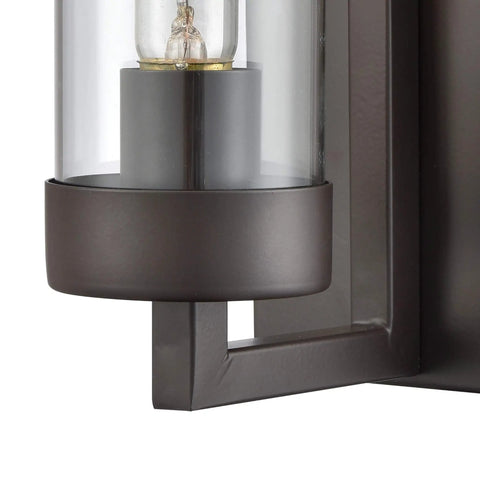 Close-up of Holbrook One Light Sconce in oil rubbed bronze with clear blown glass, showcasing bulb holder.