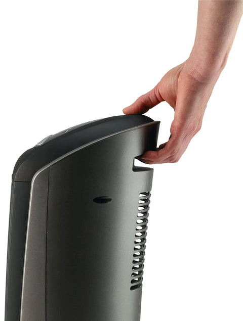 Close-up of a person holding a 1500W Ceramic Tower Space Heater With Remote, Thermostat, Timer And Wide Oscillation, side view