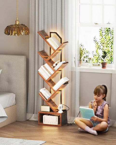 Tree Bookshelf With LED Lights, 6-Tier Narrow Bookcase For Small Spaces, Tall Steel And Wood Storage Shelf With Cabinet near window.