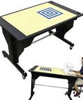Smooth Electric Height Adjusting Sewing Table With Remote Control And Tilt Top Setup Rock Solid For Standing Or Sit Down Crafters Includes Large Cutting Mat And No Sweat Motorized Lift In Classic Black, with large cutting mat.