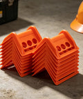 Orange 20 Pack Plastic Flatbed Edge And Corner Protectors For Trucks stacked in workshop