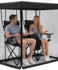 Couple sitting inside Double Sun Lounger Mosquito Net With Zipper Roof For Canopy Chairs, frameless black bug beater netting