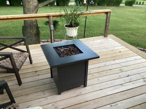 28 Inch Propane Fire Pit Table With 40K BTU Portable Smokeless Outdoor Heater And Dining Coffee Bar Table on wooden patio