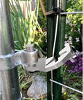 Heavy Duty T Post Gate Hinge Pins Built Tough With Rust Resistant Steel Farm Grade Target Hangers mounted on a fence post.