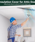 Heavy Duty Three Layer Aluminum Foam Insulation Cover For Attic Stairs And Ceiling Vents Blocks Cold Drafts Keeps Your Place Comfy Fits Up To 39 By 55 Inches, installed above an attic door by a worker.