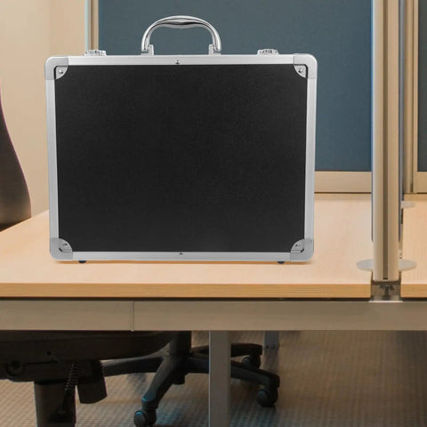 Slick Aluminum Alloy Toolbox Briefcase With Heavy Duty Hard Shell Design For Hand Tools Camera Gear And Tech Essentials Portable Equipment Rig For Pros On The Go on a desk.