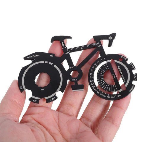 Hand holding the Compact Bicycle Shaped Multitool Keychain made from durable stainless steel for on-the-go bike repairs.