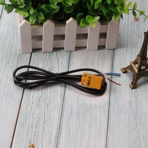 3 Pack TL W5MC1 5mm Inductive Proximity Sensor 3 Wire NPN DC 6-36V Detection Switch on wooden surface with green plant