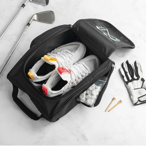 Open black personalized golf shoe bag for men and women with custom monogram and embroidered initials, showing shoes and accessories.