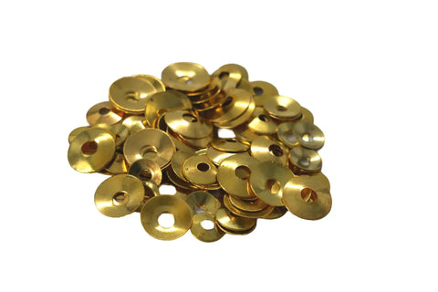 Heap of brass washers from the 100 piece Brass Clock Washers 100 Piece Set For Mantel Clock Repair And Maintenance Round Hole Washers.
