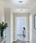 Crystal Flush Mount Ceiling Light With Remote Control, Dimmable LED Chandelier With 5 Ring Design in a modern hallway.