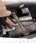Using Beefy Insulated Alligator Clips Kit to connect car battery, showing copper plated 100 Amp jumper clamp on terminal