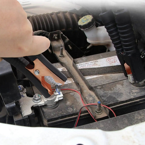 Using Beefy Insulated Alligator Clips Kit to connect car battery, showing copper plated 100 Amp jumper clamp on terminal