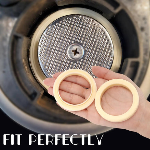 Hand holding two-pack 54mm silicone steam ring gasket replacement for Breville and Sage espresso machines, close-up view.