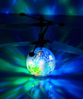 Indoor Hand Operated Flying Orb Ball Toy For Kids With LED Lights Remote Control Mini UFO Drone glowing in dark room