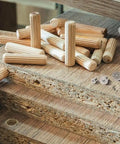 Pro Grade Dowel And Tenon Center Points Set 8 Solid Steel Drill Bit Markers with dowels on wood board