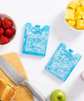 Maxcold Ice Block Four Pack Reusable Freezable Gel Cooling Blocks For Lunches Beverages And Meal Prep Non Toxic Ultratherm Gel on cutting board