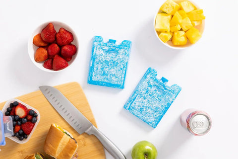 Maxcold Ice Block Four Pack Reusable Freezable Gel Cooling Blocks For Lunches Beverages And Meal Prep Non Toxic Ultratherm Gel on cutting board