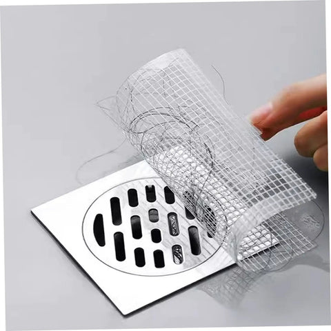Disposable Hair Drain Stickers placed over a drain, demonstrating self-adhesive fine mesh cover for shower use.