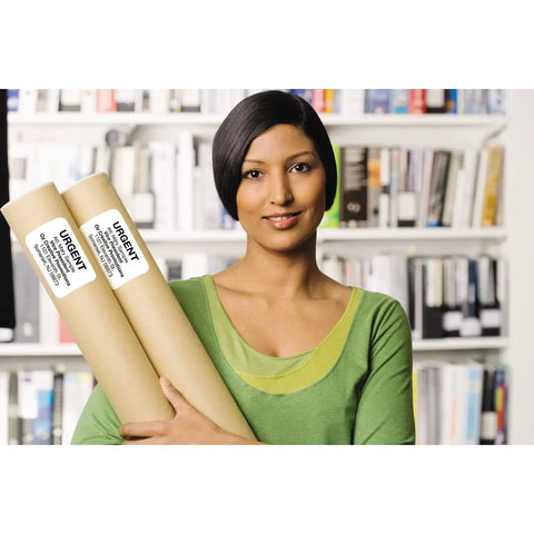 A woman holding two rolled-up documents with labels in front of a bookshelf, demonstrating the Ultra Fast Network Label Printer With Bluetooth And Ethernet Wireless Connectivity Slick Monochrome Printing Up To One Hundred Ten Labels Per Minute Dead Simple Setup For Professional Workflows.