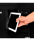 User placing tablet in Heavy Duty Two Tier Eight Door Tablet Cell Phone Locker Featuring Rock Solid Keyed Compartments And Built In Hasps.