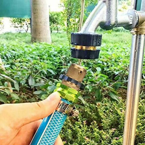 Garden Hose Quick Connectors Three Quarter Inch Brass Easy Connect Hose Adapter Kit With Five Male And Female Connectors And Extra Rubber Washers For Fast Leak Free Watering And Simple No Fuss Setup being attached to a garden faucet.