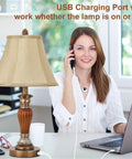 Smiling woman beside a Two Pack Touch Bedside Lamps With USB A And USB C Ports, 3 Way Dimmable Nightstand Lights With Bulbs Included.