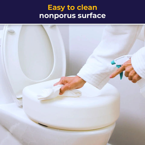 Person cleaning 4-Inch Portable Toilet Seat Riser For Seniors With No-Tool Install, on a round toilet.