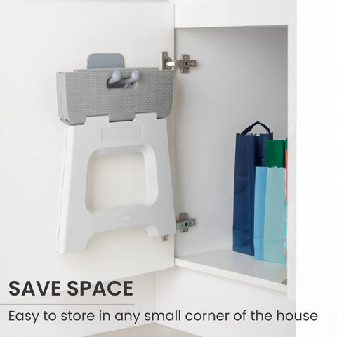 Compact Foldable Step Stool for Adults Up to 330 Pounds stored inside a cabinet, showing easy slim storage feature.