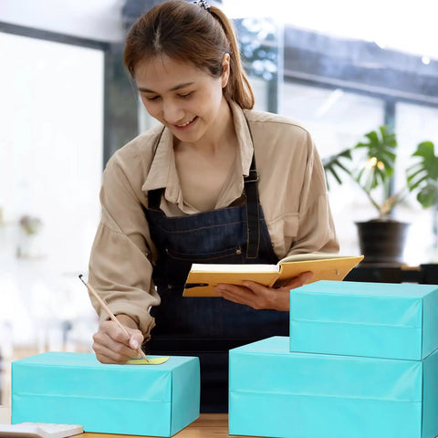 Woman preparing teal non padded poly mailers 60 pack self sealing variety pack with five sizes 6x9 9x12 10x13 12x15.5 14.5x19 inches