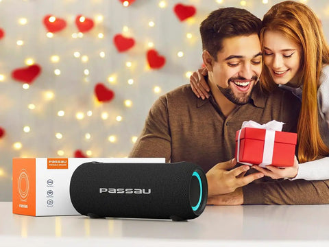 Couple exchanging gift with Portable Bluetooth Speaker With 40W Peak Power And Deep Bass From Dual Passive Radiators in the foreground