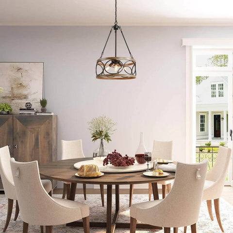Farmhouse Drum Chandelier With Faux Wood Finish hanging over dining table, modern open-frame light fixture for living spaces.