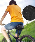 Cyclist using Rear Saddle Bag Organizer for Bike Touring and Bikepacking, Waterproof Split Seat Pack with water-resistant fabric close-up