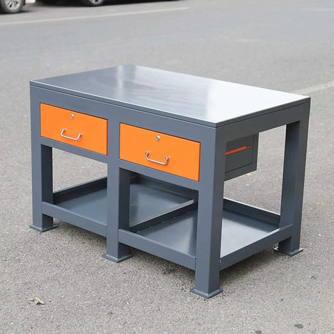 Industrial Grade Steel Workbench Featuring Two Secure Locking Drawers And Quick Access Shelf in gray and orange with flat surface.
