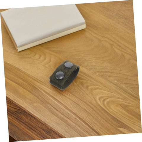 Close-up of a Six Pack Durable Nylon Belt Buckle Quick Release Webbing Clip on a wooden table.