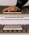 Hand applying Solid Acoustic Foam Panels For Room Noise Blocking Quick Rebound Soundproof Wall Tiles Peel And Stick, showcasing texture.