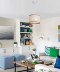Bohemian Wood Beaded Chandelier Three Light Pendant With White Finish in a cozy living room setting with blue accents.