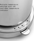 Close-up of a stainless steel electric kettle base with precision temperature control from 104 to 212 F and LED indicators.