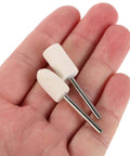 Hand holding two wool felt polishing wheels with 1/8 inch shank, part of the 40 Piece Wool Felt Polishing Wheel Set With One Eighth Inch Shank For Drill Buffing Attachments Ideal For Jewelry Wood And Metal Finishing Cylinders And Tapered Polisher Attachments.